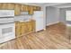 Kitchen with wood cabinets and white appliances at 7450 35Th N St # 1604, Pinellas Park, FL 33781