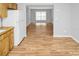 Kitchen with wood cabinets and view into living room at 7450 35Th N St # 1604, Pinellas Park, FL 33781