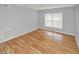 Living room with wood-look floors and window at 7450 35Th N St # 1604, Pinellas Park, FL 33781