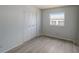 Bright bedroom with neutral walls and wood-look floors at 207 Dolphin N Dr, Oldsmar, FL 34677