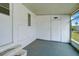 Enclosed porch with ample space and view of backyard at 207 Dolphin N Dr, Oldsmar, FL 34677