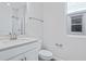 Simple bathroom with white vanity and shower at 5943 Jensen View Ave, Apollo Beach, FL 33572