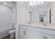 Bathroom with double vanity, large mirror, and shower at 5943 Jensen View Ave, Apollo Beach, FL 33572