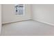Simple bedroom with neutral carpeting and window at 5943 Jensen View Ave, Apollo Beach, FL 33572
