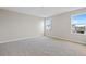 Bright bedroom with neutral walls and carpet at 5943 Jensen View Ave, Apollo Beach, FL 33572