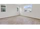 Spacious bedroom with tile flooring and multiple windows at 5943 Jensen View Ave, Apollo Beach, FL 33572