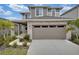 Two-story home with stone accents and two-car garage at 5943 Jensen View Ave, Apollo Beach, FL 33572