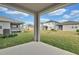 Covered patio overlooking a grassy backyard at 5943 Jensen View Ave, Apollo Beach, FL 33572