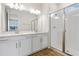 Bathroom with double vanity, quartz countertop and a glass shower at 5969 Jensen View Ave, Apollo Beach, FL 33572