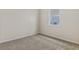 Simple bedroom with neutral walls and carpet at 5969 Jensen View Ave, Apollo Beach, FL 33572