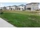 Community backyard with well-maintained lawn at 5917 Jensen View Ave, Apollo Beach, FL 33572