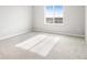 Well-lit bedroom with carpeted floors and window at 5917 Jensen View Ave, Apollo Beach, FL 33572