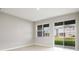 Bright Gathering room with sliding glass doors leading to backyard at 5917 Jensen View Ave, Apollo Beach, FL 33572