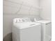 Laundry room with washer, dryer, and shelving at 5917 Jensen View Ave, Apollo Beach, FL 33572