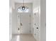 Clean entryway with white door and arched window at 12016 Fruitwood Dr, Riverview, FL 33569