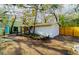 Large backyard featuring wooden fence, arbor and shed at 10020 Jungle St, New Port Richey, FL 34654