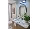 Modern bathroom with marble vanity and updated fixtures at 407 Belvedere Oval, Temple Terrace, FL 33617