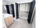 Bathroom with a double vanity and built-in shelving at 407 Belvedere Oval, Temple Terrace, FL 33617