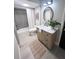 Modern bathroom featuring a vanity with marble top and updated fixtures at 407 Belvedere Oval, Temple Terrace, FL 33617
