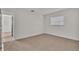 Spacious bedroom with neutral carpeting and access to another room at 407 Belvedere Oval, Temple Terrace, FL 33617