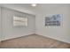 Well-lit bedroom with two windows and neutral decor at 407 Belvedere Oval, Temple Terrace, FL 33617