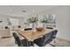 Open concept dining area with a light wood table at 407 Belvedere Oval, Temple Terrace, FL 33617