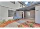 Inviting front entry with brick walkway and updated siding at 407 Belvedere Oval, Temple Terrace, FL 33617