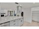 Modern kitchen with stainless steel appliances and white quartz countertops at 407 Belvedere Oval, Temple Terrace, FL 33617