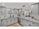 Updated kitchen featuring gray shaker cabinets and stainless steel appliances at 407 Belvedere Oval, Temple Terrace, FL 33617