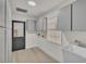 Bright laundry room with ample storage and cabinets at 407 Belvedere Oval, Temple Terrace, FL 33617
