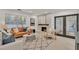 Open living space featuring a fireplace and French doors at 407 Belvedere Oval, Temple Terrace, FL 33617