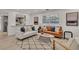 Bright living room with contemporary furniture and kitchen views at 407 Belvedere Oval, Temple Terrace, FL 33617