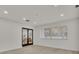 Light-filled living room with hardwood floors and French doors at 407 Belvedere Oval, Temple Terrace, FL 33617