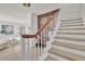 Modern light-colored staircase with wooden handrail at 407 Belvedere Oval, Temple Terrace, FL 33617