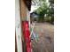 Backyard with red ladder and various building materials at 109 W Floribraska Ave, Tampa, FL 33603