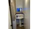 Small pedestal sink with blue accent lights and mosaic tile at 109 W Floribraska Ave, Tampa, FL 33603