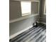 Another bedroom featuring gray walls and wood-look floors at 109 W Floribraska Ave, Tampa, FL 33603