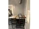 Small dining area with four chairs and gray table at 109 W Floribraska Ave, Tampa, FL 33603