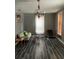 Living room with chandelier, couch and wood-look floors at 109 W Floribraska Ave, Tampa, FL 33603