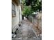 Side yard with a dirt path and chain link fence at 109 W Floribraska Ave, Tampa, FL 33603