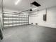 Spacious garage with painted floor and automatic door opener at 9585 Calumet Blvd, Port Charlotte, FL 33981