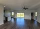 Open living space with sliding glass doors and hardwood floors at 9585 Calumet Blvd, Port Charlotte, FL 33981