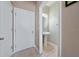 Powder room with pedestal sink and storage at 8609 Fiddleleaf Ct, Tampa, FL 33647
