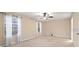 Spacious bedroom with ceiling fan and large windows at 8609 Fiddleleaf Ct, Tampa, FL 33647