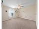 Bright and airy bedroom with carpeted floor at 8609 Fiddleleaf Ct, Tampa, FL 33647