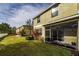 View of the townhome from the backyard at 8609 Fiddleleaf Ct, Tampa, FL 33647