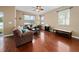 Living room with hardwood floors and comfy seating at 8609 Fiddleleaf Ct, Tampa, FL 33647