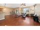 Open living space with hardwood floors and access to kitchen at 8609 Fiddleleaf Ct, Tampa, FL 33647