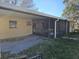 House exterior with covered patio and screened enclosure at 4903 Green Key Rd, New Port Richey, FL 34652