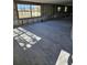 Spacious living area with large windows and tile flooring at 4903 Green Key Rd, New Port Richey, FL 34652